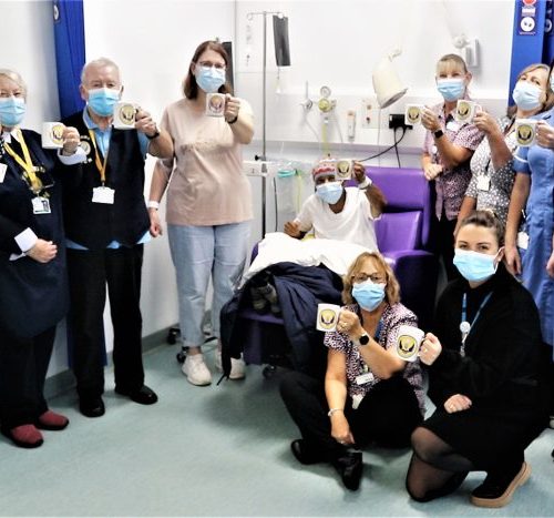 Patients, staff and volunteers raise a cup of tea in celebration of our voluntary services.