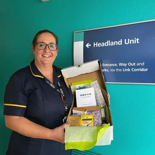 Specialist Oncology nurse Amy Byfield holding a box of kindness