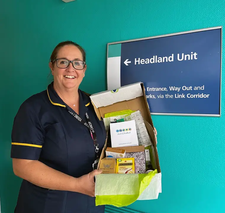 Specialist Oncology Nurse Amy Byfield holding a box of kindness
