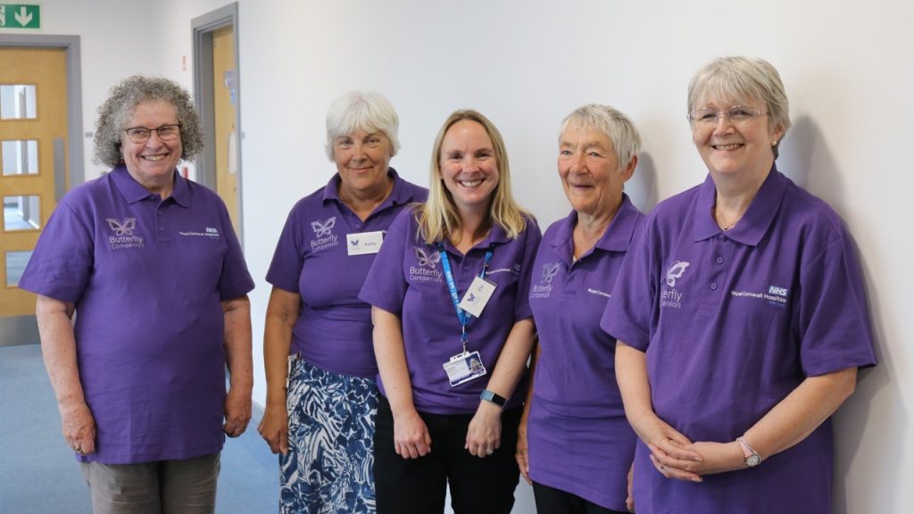 Group of 5 ladies in purple t-shirts - the Butterfly Companion Volunteers and co-ordinator
