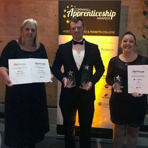 Three award winners from the cornwall apprenticeship awards holding their awards.
