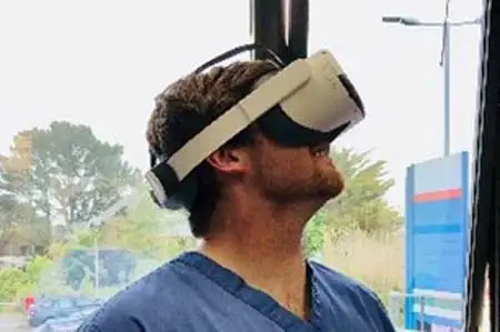 Image depicting a clinician conducting clinical research via a Virtual Reality (VR) headset